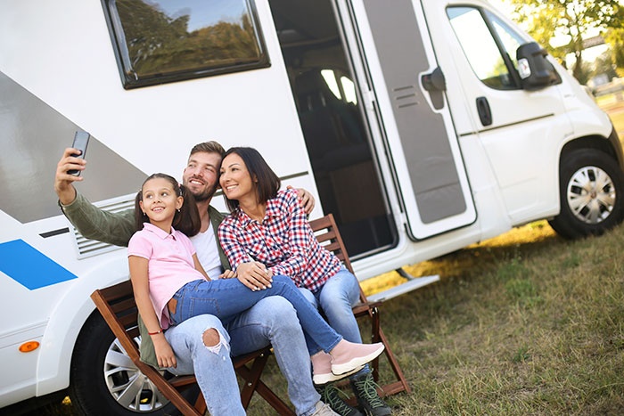 Family Taking selfie in front of their RV