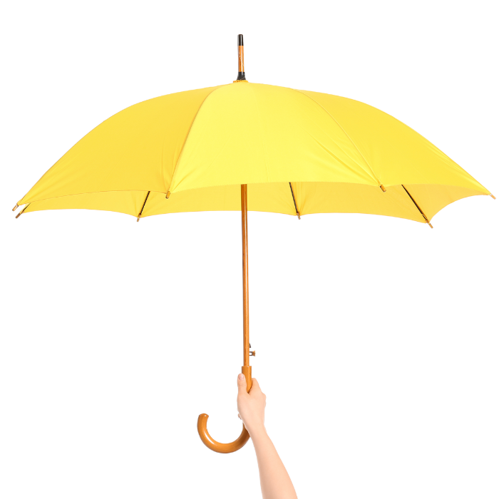 Hand raising yellow umbrella