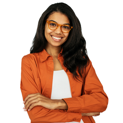 Young woman with glasses and orange blazer smiling with crossed arms